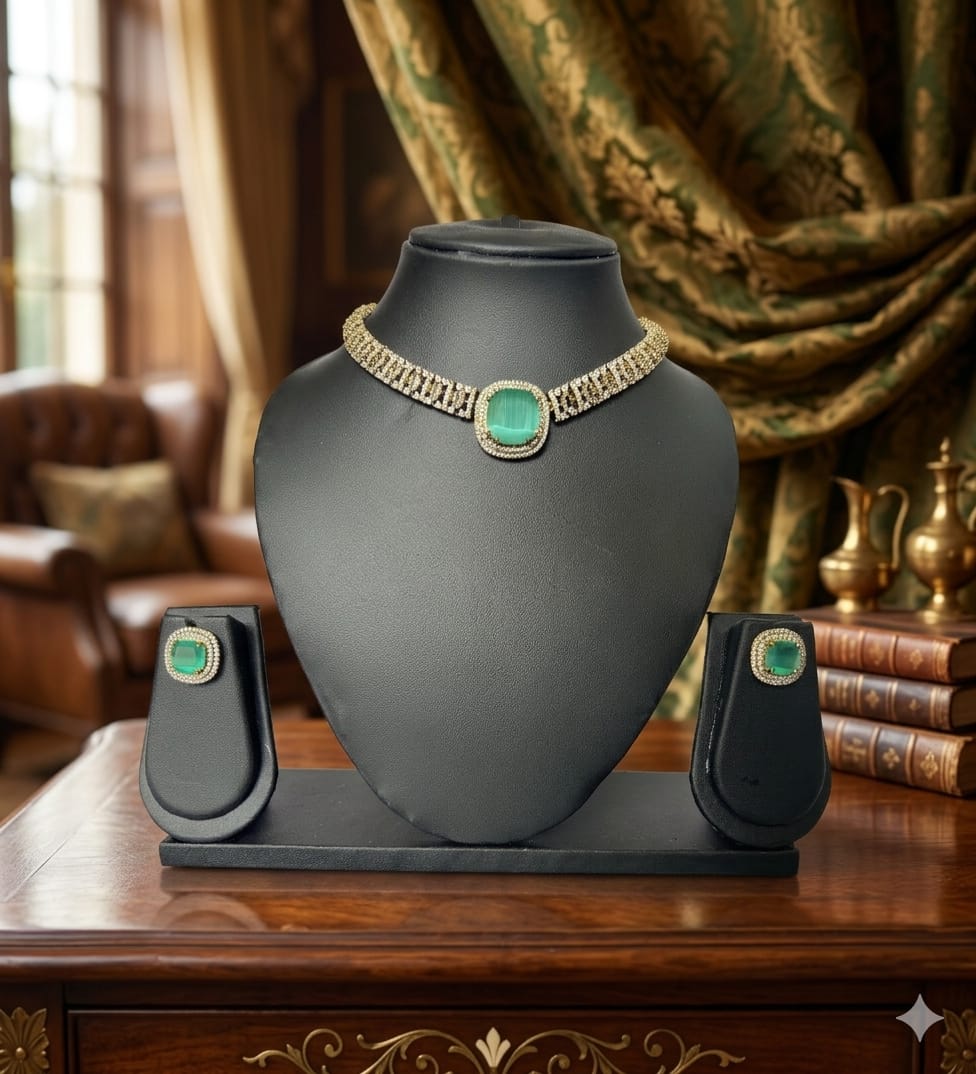 Jewelry display with a necklace on a black stand against a decorative background