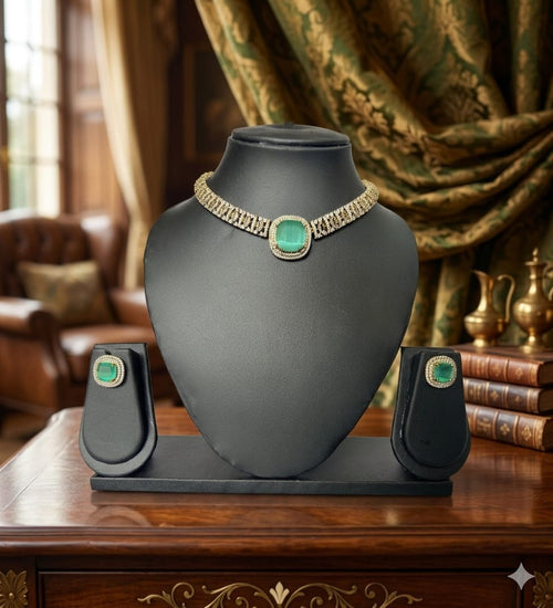 Jewelry display with a necklace on a black stand against a decorative background