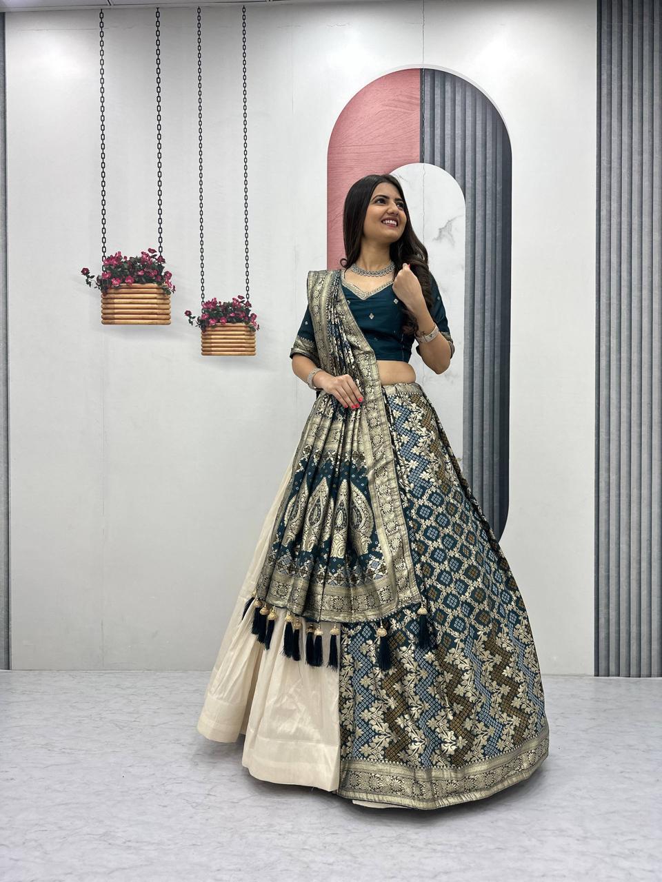 Woman in a traditional outfit standing in front of a mirror with decorative elements.